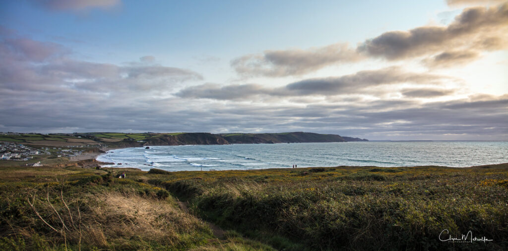 surfing bude cornwall. landscape view of widemouth bay taken from the north headland of the bay