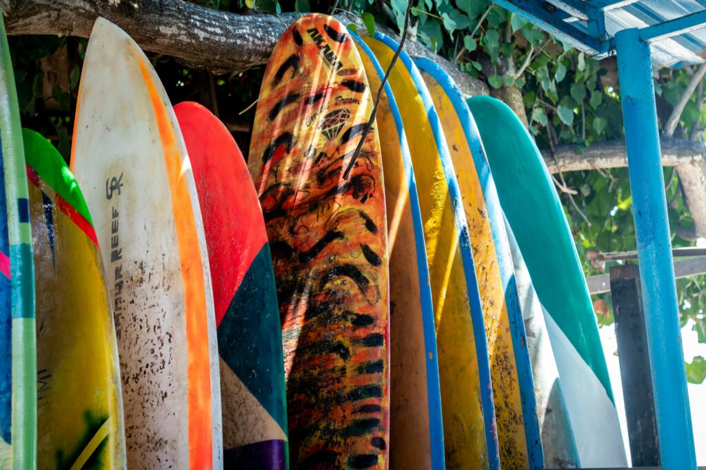 cornwall surfboards. collections of surfboards standing up in a rack