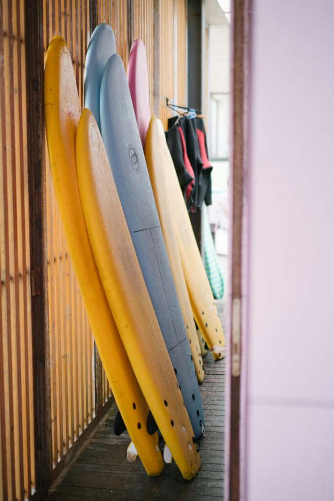 surf renting. Softboards leaning up against the wall in a surf shop.